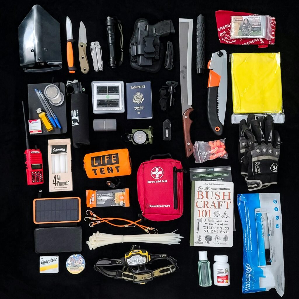 Cheap prepping gear flat lay with survival essentials under $20 including knives, duct tape, paracord, water filter, and first aid kit.
