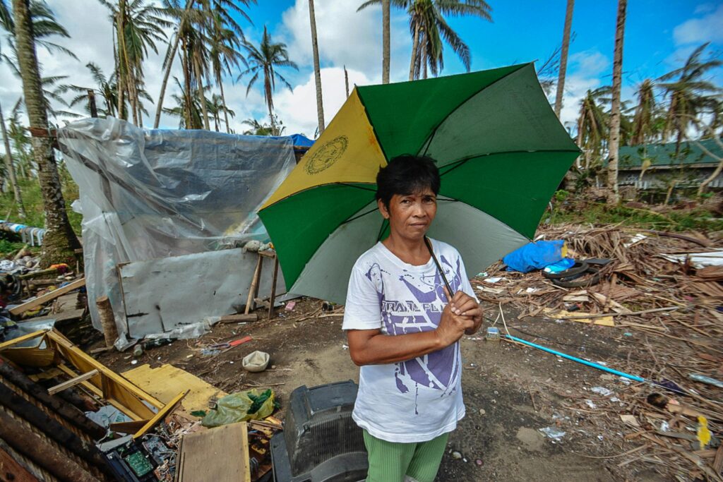 Family preparing home for hurricane by securing supplies and checking damage after the storm – Hurricane Survival Plan