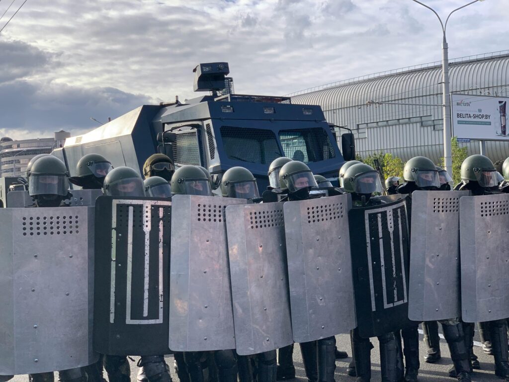 Police forming a defensive line during civil unrest preparedness scenarios in an urban environment
